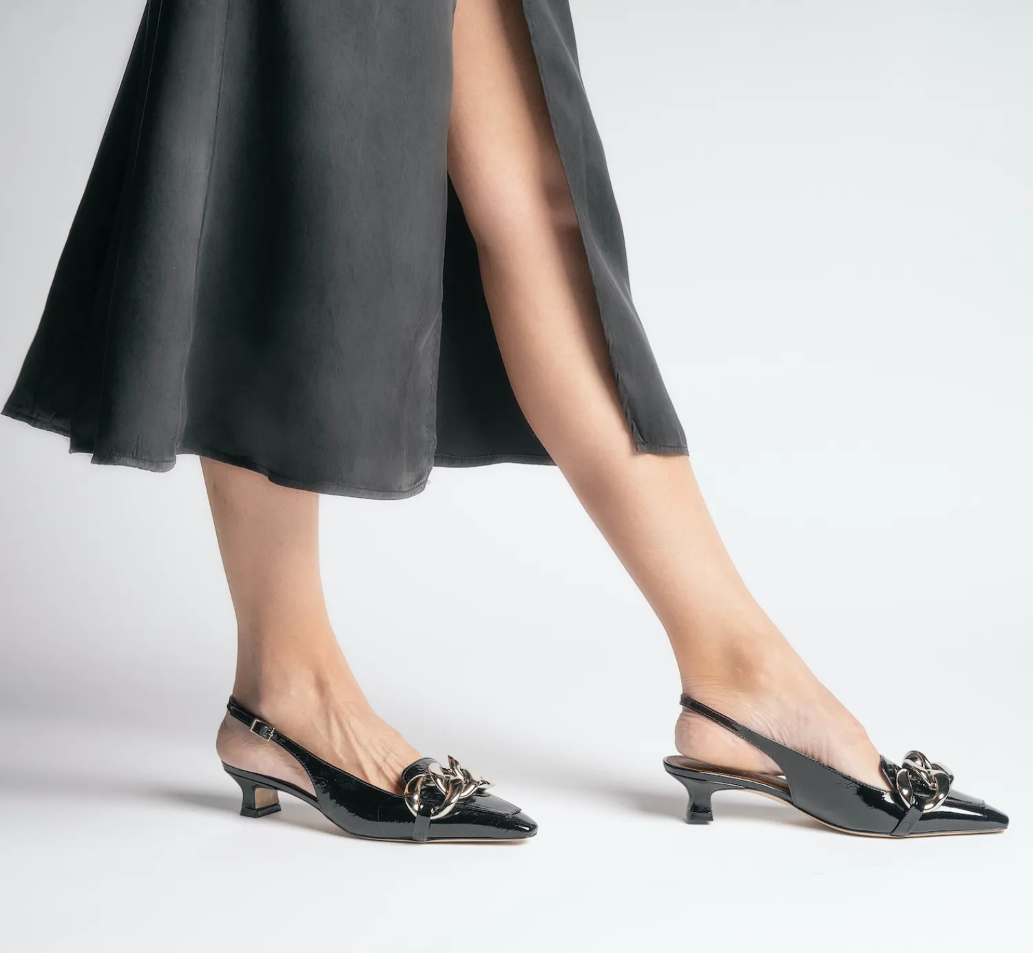 Erity Black Naplak Slingback Pumps